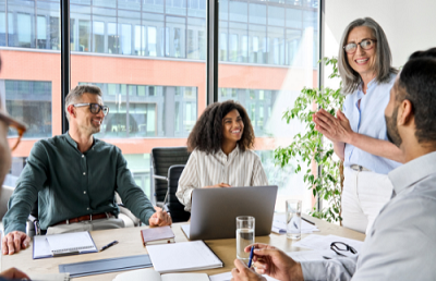 4 people having a meeting in an office